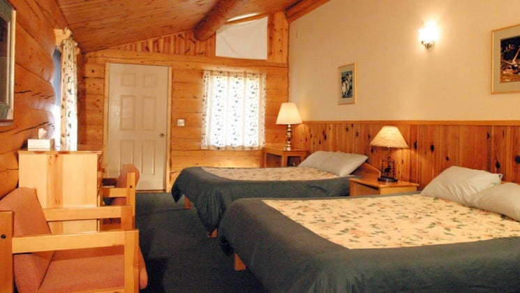 One of the guest cabins at Kantishna Roadhouse decorated with Alaskan charm and style. The rooms are built from White spruce logs. It is furnished with two beds and down comforters.