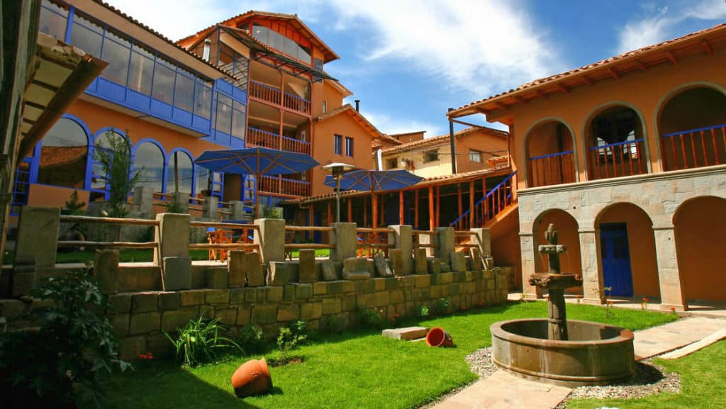 The courtyard with a lawn and a fountain at the Casa Andina Classic Cusco San Blas, located in historic Cusco, Peru, just three blocks off the main plaza.