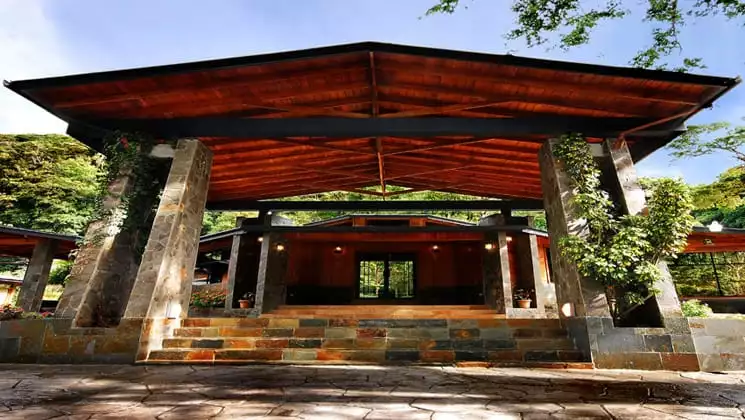 Entryway to lobby area of Casa Grande Bambito, surrounded by green forest in Panama