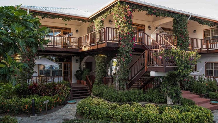 Walkways and balconies surrounded by vibrant local foliage at Chabil Mar Villas in Belize