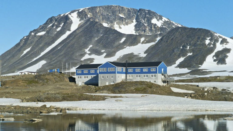 The exterior of Hotel Kulusuk, a remote yet comfortable lodge with a unique vantage point between Apusiaajik Glacier and Isikajia Mountain in Greenland