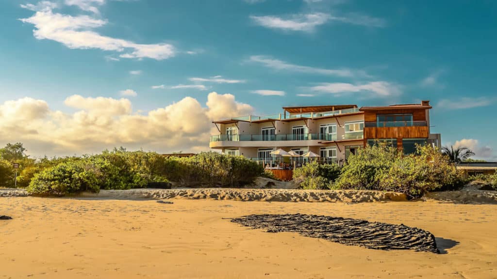 The sustainable resort Iguana Crossing Boutique Hotel sits on the beachfront in Puerto Villamil on Isabela Island in the Galapagos Islands.