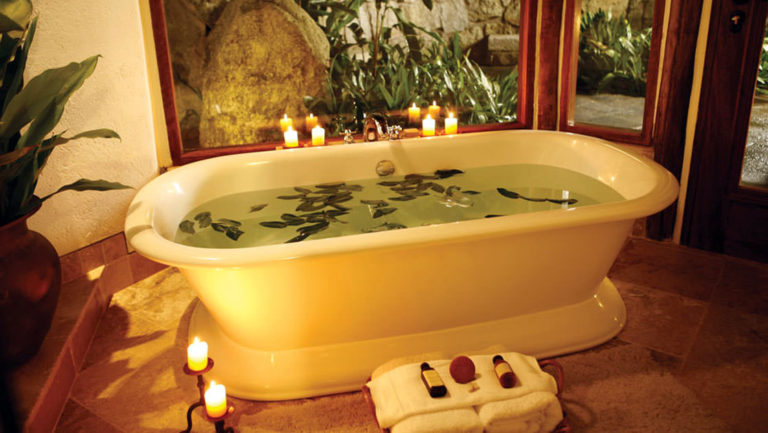 A bath is drawn at the Inkaterra Machu Picchu Pueblo Hotel, with warm light and water steemed with local botanical extracts (mint, eucalyptus and orchids).