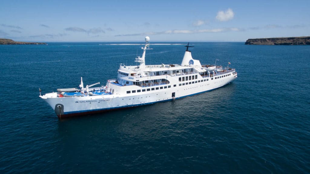 Galapagos Legend ship sailing on blue water photographed from above