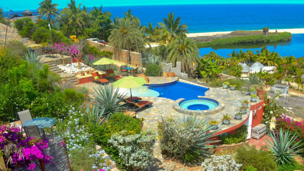 The boutique Baja hotel Los Colibris Casitas is has a deep connection to the local environment with desert vibes, pools, vegetation and views of the ocean