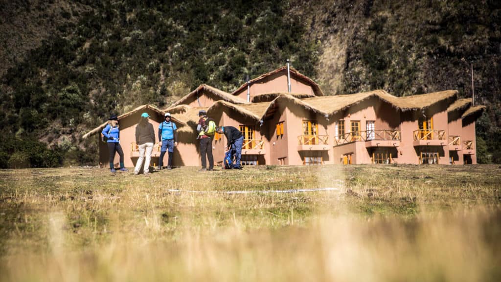A group of trekkers stand outside the Salkantay Lodge and Adventure Resort, one of four hotels that are part of the Mountain Lodges of Peru on the Inca Trail to Machu Picchu