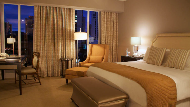The Tower Executive Room, with a king bed, has a view of Panama City at night