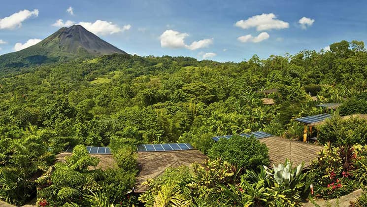 A panoramic view of the lush jungle and the Arenal Volcano National Park, adjacent to the Nayara Hotel, Spa & Gardens, a luxury boutique hotel in Costa Rica