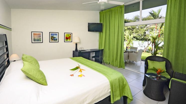 Green curtains and blankets brighten up the contemporary bungalows at the Bocas del Mar Hotel in Panama