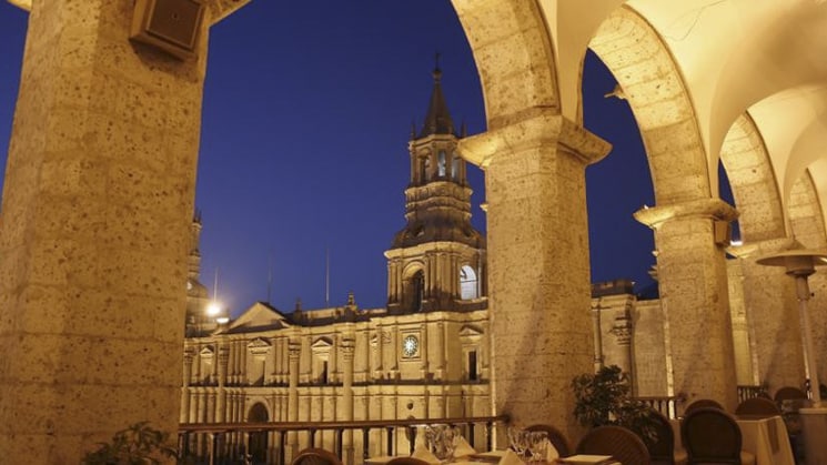 A view beneath an arched pathway of Sonesta Posada Del Inca Arequipa, a renovated hotel in the heart of the city