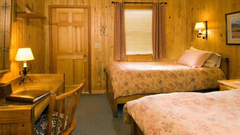 Another look at the room with two twin beds inside the North Face Lodge, a traditional inn located in the Alaskan wilderness within Denali National Park
