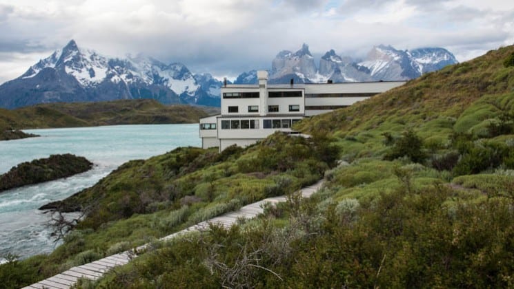 Exterior of Explora Torres del Paine Lodge in Chile, placed among mountains on the shores of Lake Pehoe
