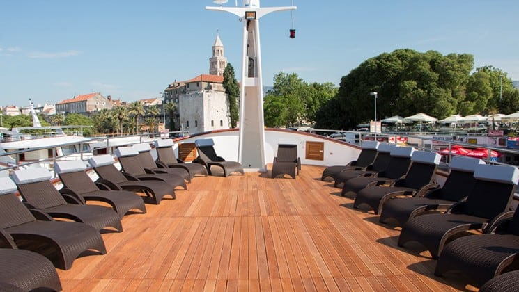 Fantazija deck on the bow with lounge chairs.