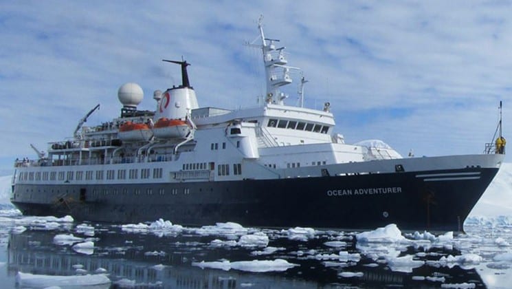 Ocean Adventurer ship exterior picture of starboard side of ship while sailing through small ice bergs.