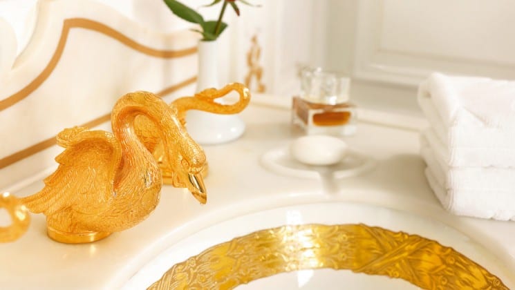 a golden swan faucet and gold lined sink aboard the Lindblad Sea Cloud mediterranean luxury yacht