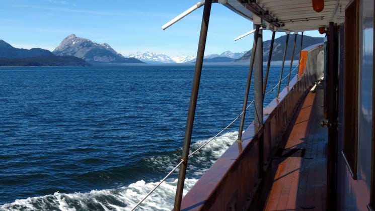 Starboard side deck of Sea Wolf yacht in calm Alaska waters