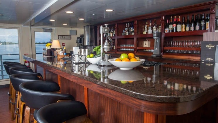 bar with barstools and windows in the background aboard the Safari Voyager Costa Rica small ship