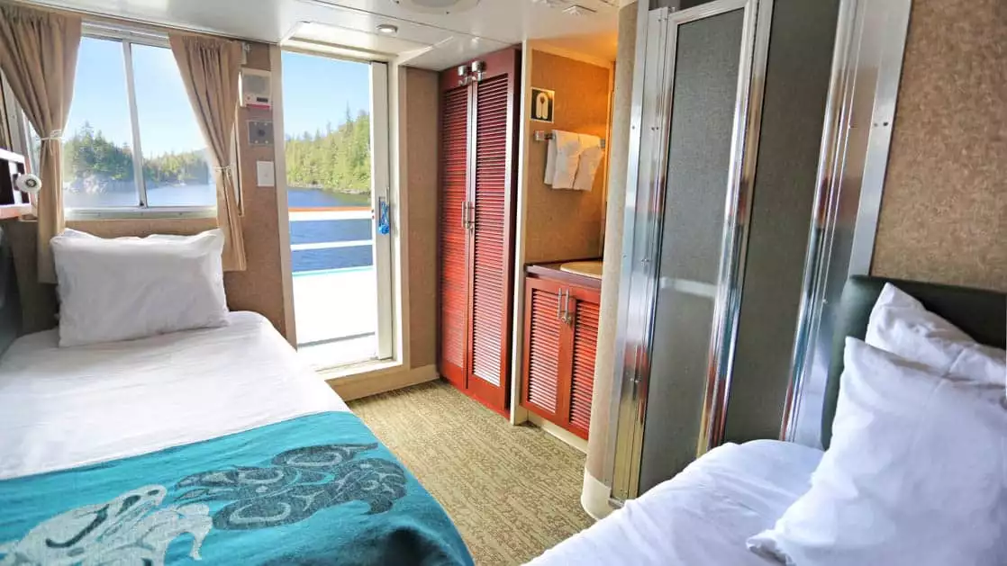 Category AA cabin with two twin beds perpendicular aboard Admiralty Dream