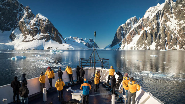 Bow of ship through Lemaire Channel on a sunny Antarctica day