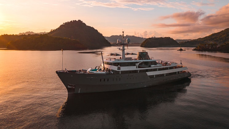 A bring orange and pink sunset as Indonesia yacht Aqua Blu sails