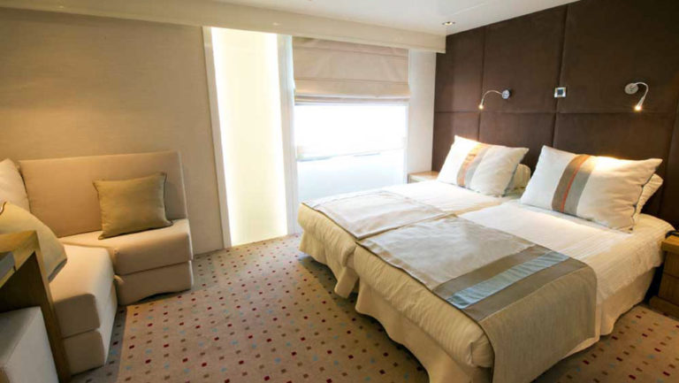 Category P cabin with sitting area and double bed aboard Varitey Voyager.