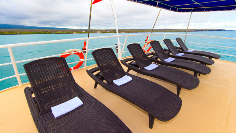 Chaise lounges on Main deck outside on the Cachalote Explorer.