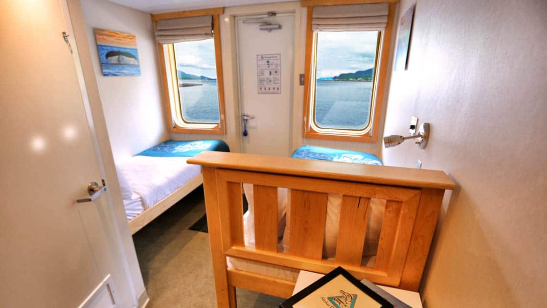 Category AA stateroom aboard Chichagof Dream with small windows and twin beds