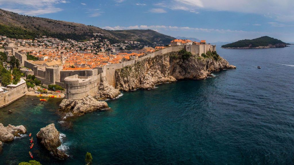 Dalmatian Coast Cruise view of Dubrovnik Croatia showing steep shoreline with houses perched on top