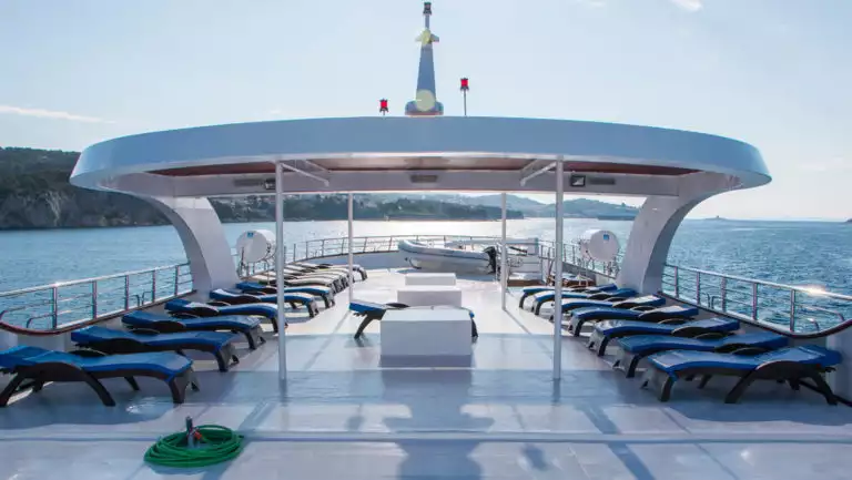 Small ship cruise Futura sun deck with lounge chairs.