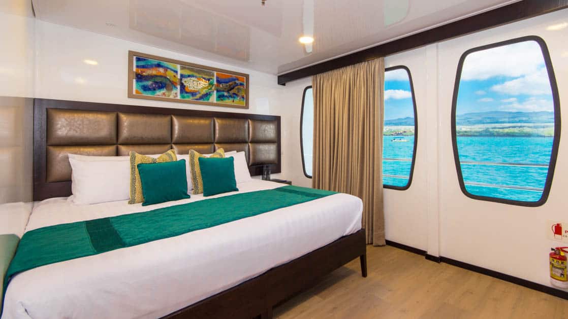 Double Cabin aboard Alya with large bed and large windows.