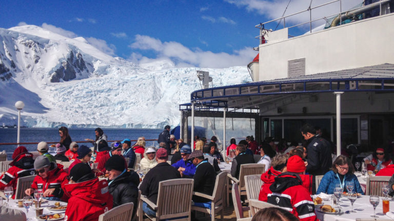 Outdoor dining with passengers on the sun deck of the Hebridean Sky.