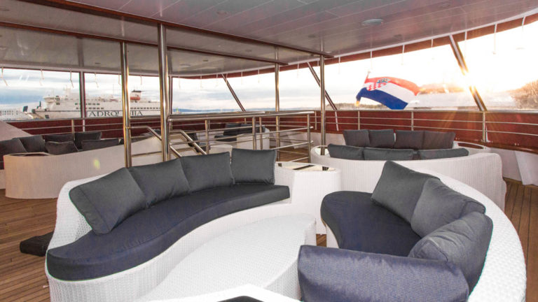 Maritimo outdoor deck with couches and table.