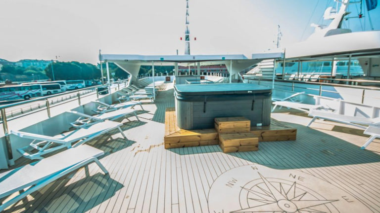 Markan sun deck with hot tub and lounge chairs.