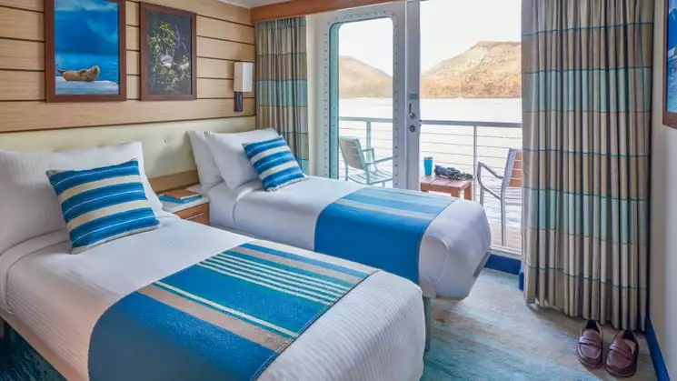 Category 4 cabin with twin beds aboard National Geographic Venture