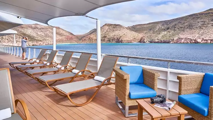 Lounge chairs near balcony on Sun Deck of National Geographic Venture expedition ship