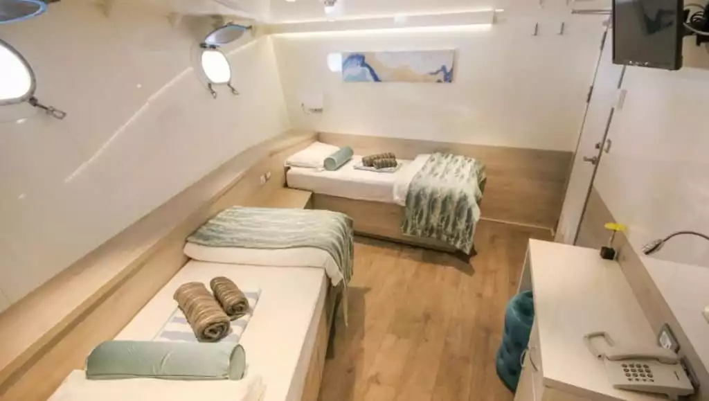 Cabin #13 with fixed twin beds aboard Nautilus