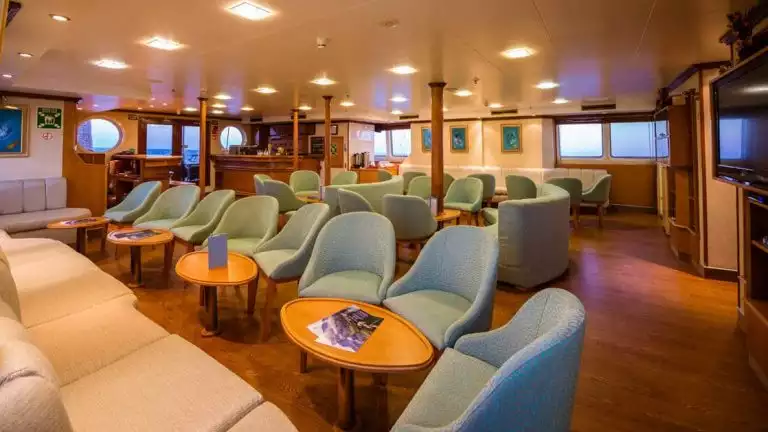 Lounge bar with many chairs and seating areas aboard Panorama II