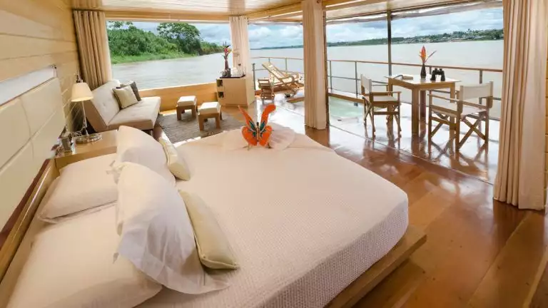 The Deluxe Suite aboard the Delfin I features a private spa with lots of room and epic views of the Amazon River Basin in Peru