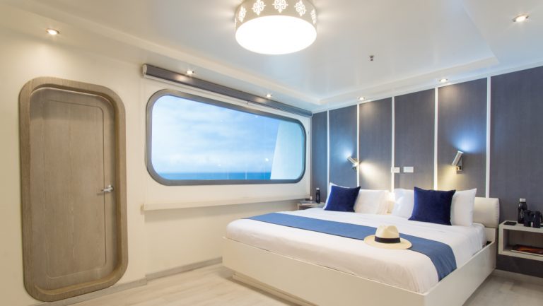 Stateroom with matrimonial bed and window aboard Galapagos Horizon