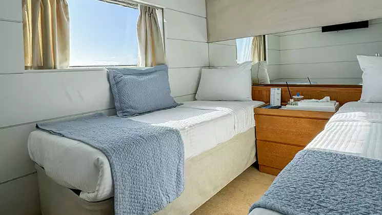 Harmony G Category P stateroom with 2 twin beds, a large window and blue and white bedding