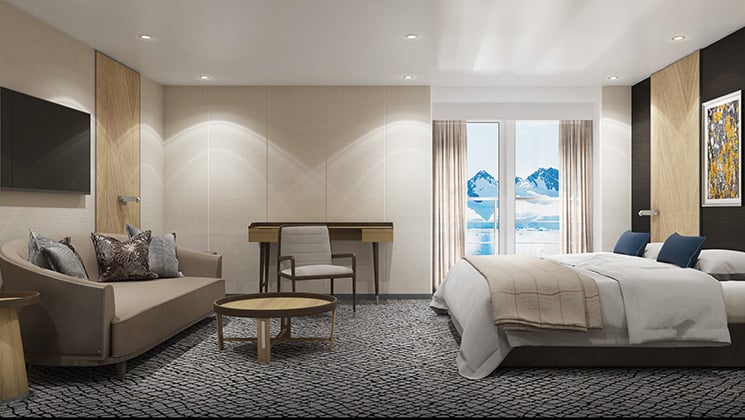 Penthouse Suite with king bed, private balcony and separate sitting area aboard Magellan Explorer Antarctica expedition ship