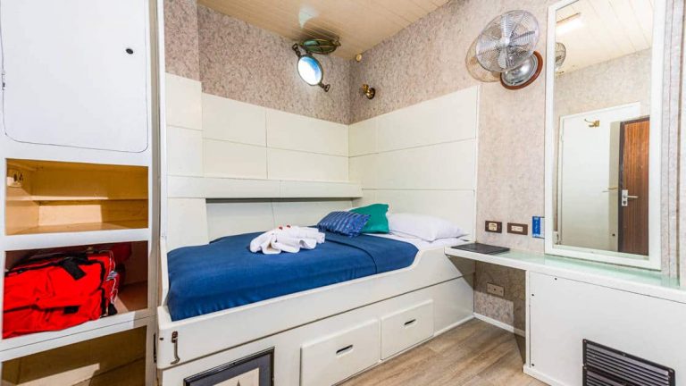 One twin bed with storage under bed aboard the Mary Anne in the Galapagos.