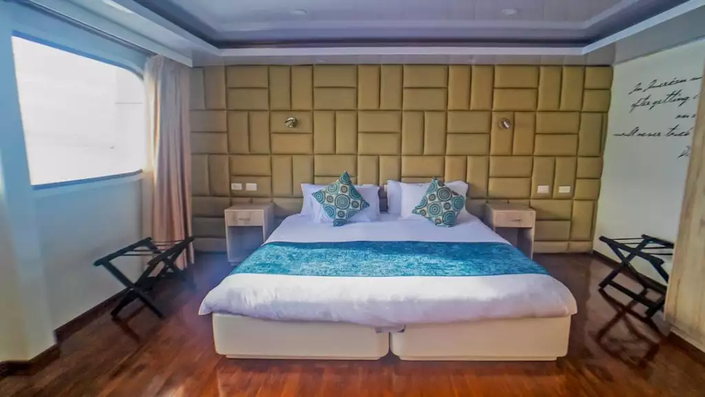 Golden Stateroom with king-size matrimonial bed aboard Petrel