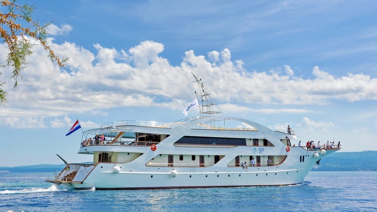 the president luxury yacht cruising in the mediterranean on a sunny day
