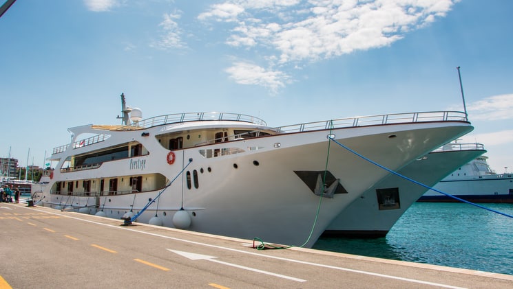 prestige luxury mediterranean yacht at dock on a sunny day