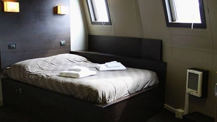 Suite Twin cabin aboard Ushuaia with double bed.