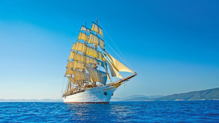 the small ship sea cloud sails across the caribbean on a blue sky day