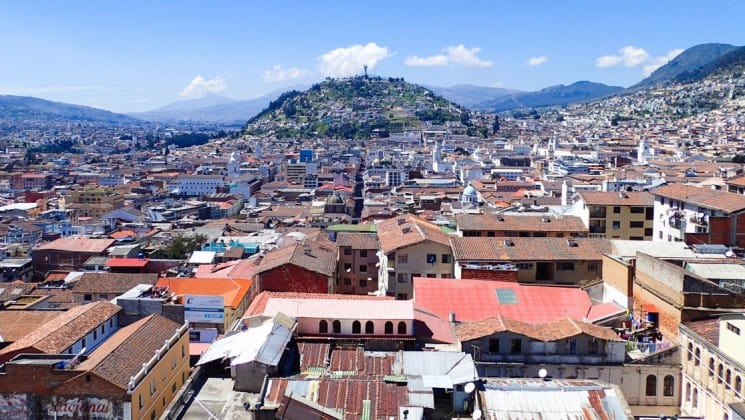 overlooking the city on a sunny day with mountains in the distance on the quito and guayaquil galapagos land tour