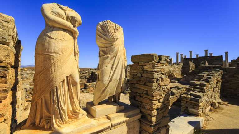 Statues at a Greek archaeological site on Delos Island, Greece. Seen on the under sail small ship cruise from Greece to the Dalmatian coast