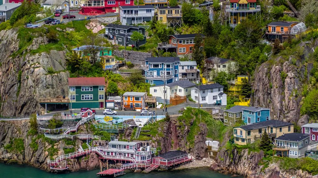 A colorful seaside village scales the rocky landscape